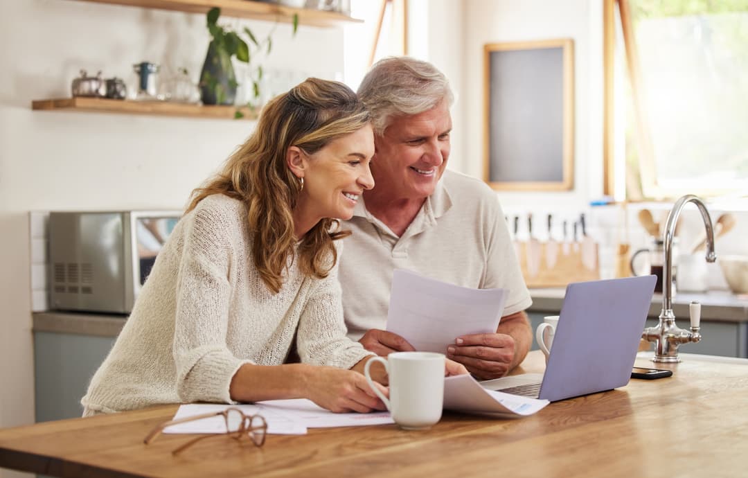 Couple in front of a laptop